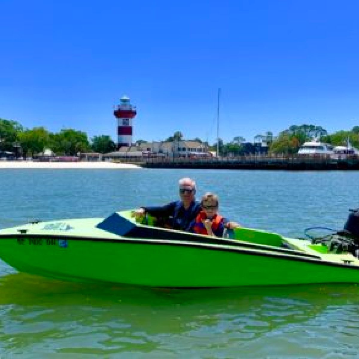 Speedboat dolphin cruise Infront of harbortown lighthouse